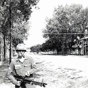 Dave Mettler holding M60 machine out side barracks of
                                      3rd platoon July1966. Nice Pipe 