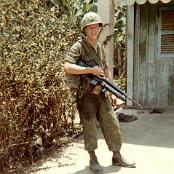 Robert (Bob)Bennett, Squad leader of the 2nd squad, 3rd
                                    Platoon, A/3/39th standing in front of the 3rd platoon hut
                                    Rach Kien, May 1967.
